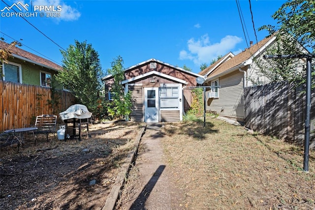 1903 W Colorado Ave, Colorado Springs, CO 80904 - back of property with fence, an outbuilding, and a shed