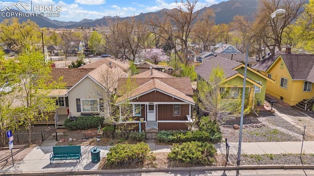 1903 W Colorado Ave, Colorado Springs, CO 80904 - view of front of home with a mountain view, fence, and a residential view