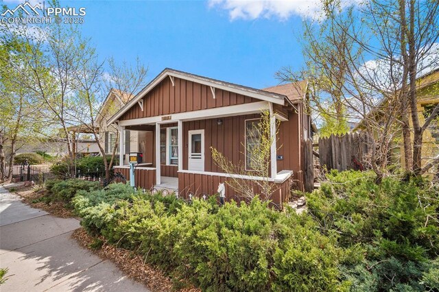 1903 W Colorado Ave, Colorado Springs, CO 80904 - craftsman-style house featuring fence, covered porch, and board and batten siding