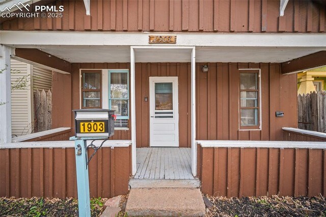 1903 W Colorado Ave, Colorado Springs, CO 80904 - doorway to property featuring board and batten siding and a porch