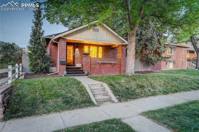 1866 S Pennsylvania St, Denver, CO 80210 - bungalow featuring brick siding and covered porch