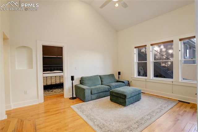 1866 S Pennsylvania St, Denver, CO 80210 - living room featuring high vaulted ceiling, a ceiling fan, and light wood-style flooring