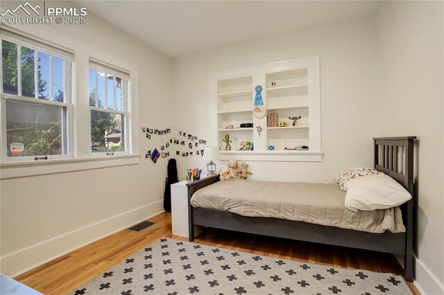 1866 S Pennsylvania St, Denver, CO 80210 - bedroom with wood finished floors and baseboards