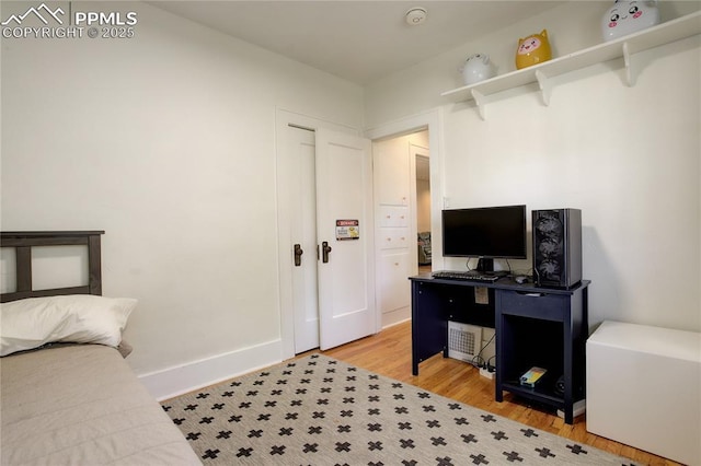 1866 S Pennsylvania St, Denver, CO 80210 - bedroom with light wood-type flooring and baseboards