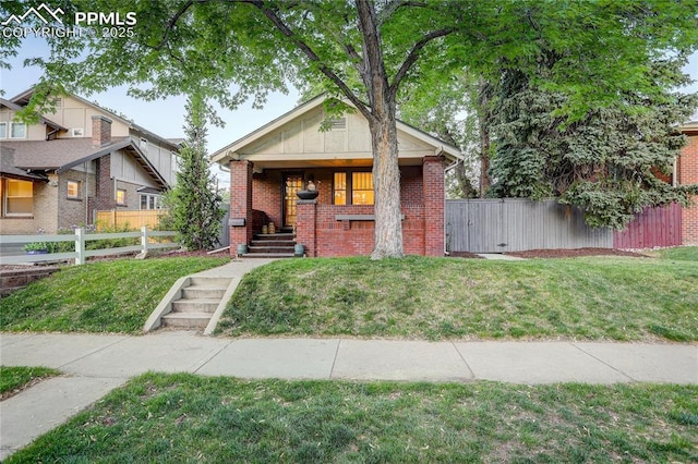 1866 S Pennsylvania St, Denver, CO 80210 - view of front facade featuring brick siding and a porch