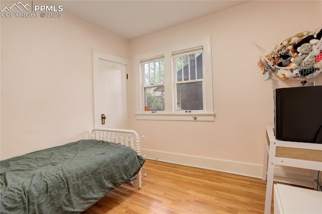 1866 S Pennsylvania St, Denver, CO 80210 - bedroom with baseboards and light wood finished floors