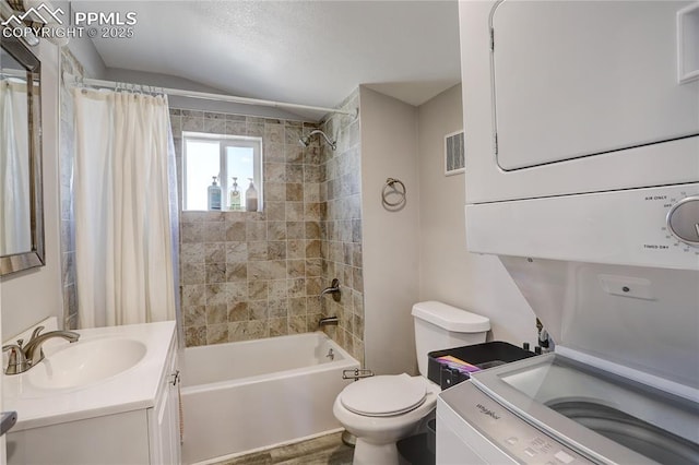 1866 S Pennsylvania St, Denver, CO 80210 - full bath with estacked washer and dryer, vanity, shower / tub combo with curtain, and vaulted ceiling