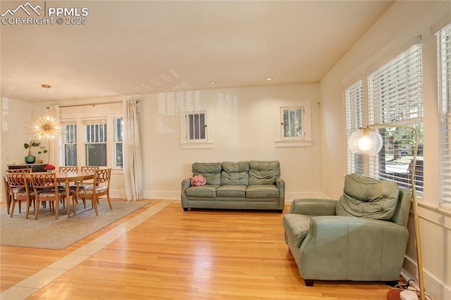 1866 S Pennsylvania St, Denver, CO 80210 - living room with light wood-type flooring, recessed lighting, and a chandelier