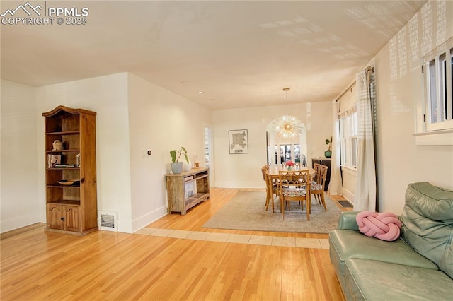 1866 S Pennsylvania St, Denver, CO 80210 - dining room featuring light wood-style floors, a chandelier, and recessed lighting