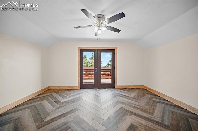 additional living space featuring vaulted ceiling, a ceiling fan, and baseboards