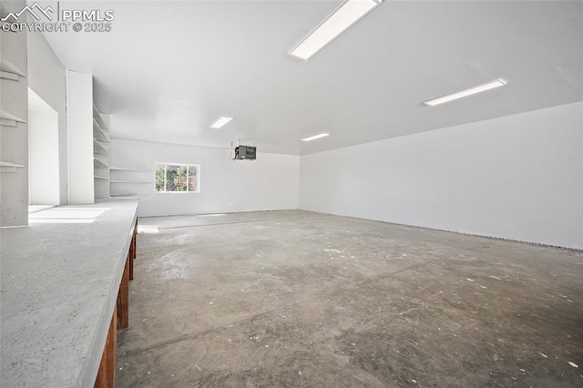 unfurnished room with concrete flooring