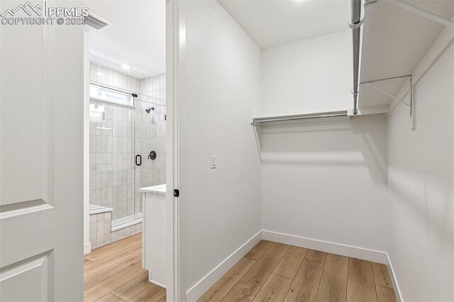 4331 Soapberry Pl, Castle Rock, CO 80108 - walk in closet with visible vents and wood finished floors
