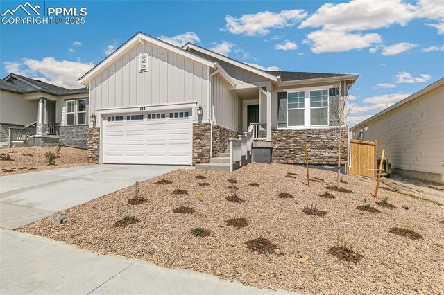 4331 Soapberry Pl, Castle Rock, CO 80108 - craftsman-style house featuring board and batten siding, driveway, stone siding, and a garage