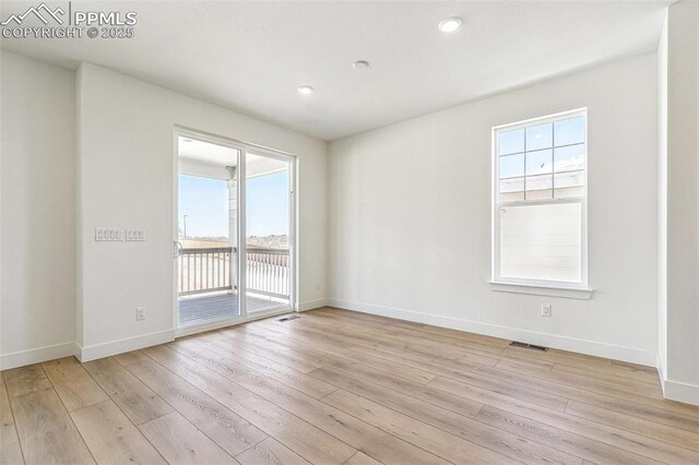 4331 Soapberry Pl, Castle Rock, CO 80108 - spare room with a wealth of natural light, light wood-style floors, visible vents, and baseboards