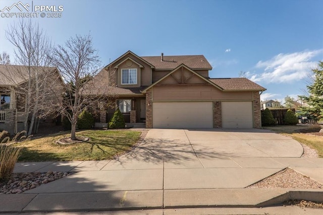 traditional-style home featuring driveway, a shingled roof, and a garage