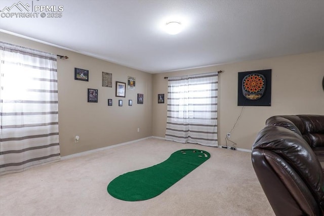 interior space with carpet floors and baseboards