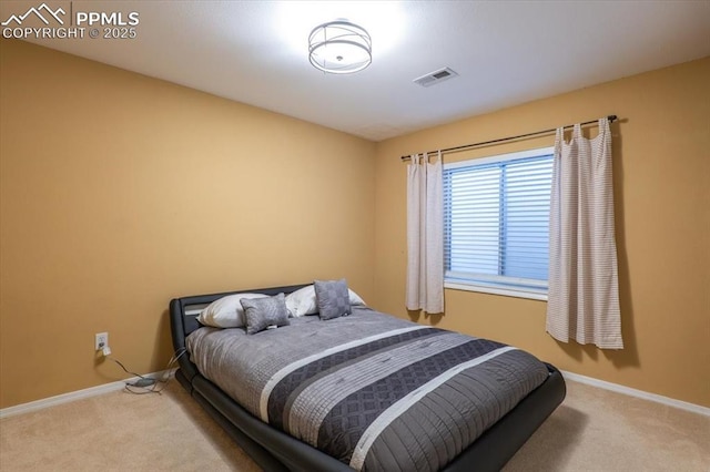 bedroom featuring baseboards, visible vents, and carpet flooring