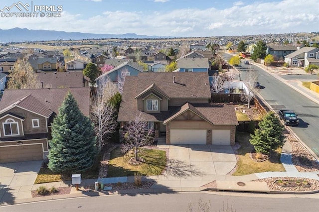 bird's eye view featuring a mountain view and a residential view