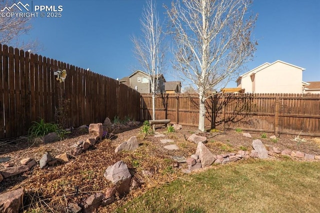 view of yard featuring a fenced backyard