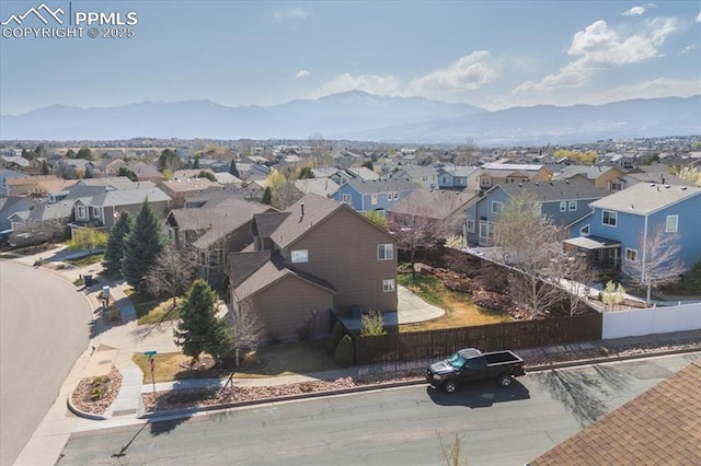 aerial view with a mountain view and a residential view