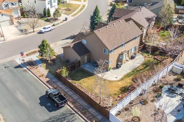 birds eye view of property with a residential view