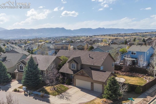 bird's eye view with a mountain view and a residential view
