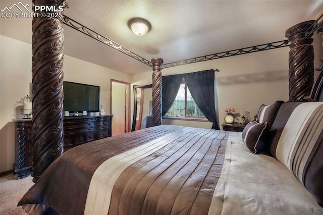 carpeted bedroom with a textured ceiling