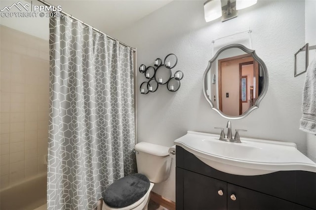 full bathroom featuring toilet, vanity, and shower / bathtub combination with curtain
