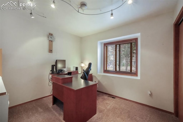 carpeted office with baseboards