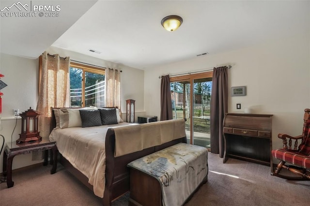 bedroom featuring visible vents, carpet flooring, and access to exterior