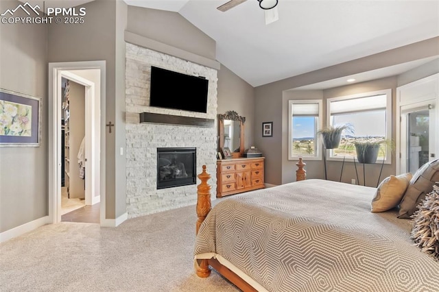 20356 Royal Troon Dr, Monument, CO 80132 - bedroom featuring vaulted ceiling, carpet floors, a fireplace, baseboards, and ceiling fan