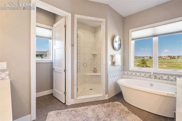 20356 Royal Troon Dr, Monument, CO 80132 - full bath featuring a freestanding tub, a stall shower, and tile patterned floors