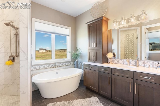 20356 Royal Troon Dr, Monument, CO 80132 - bathroom featuring a tile shower, a freestanding tub, vanity, and tile patterned flooring
