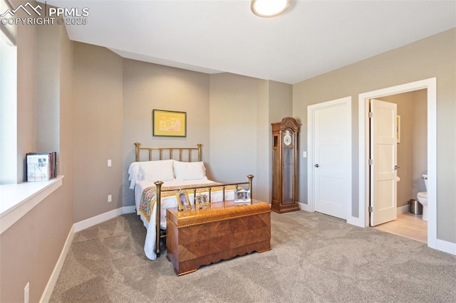 20356 Royal Troon Dr, Monument, CO 80132 - carpeted bedroom with baseboards and connected bathroom