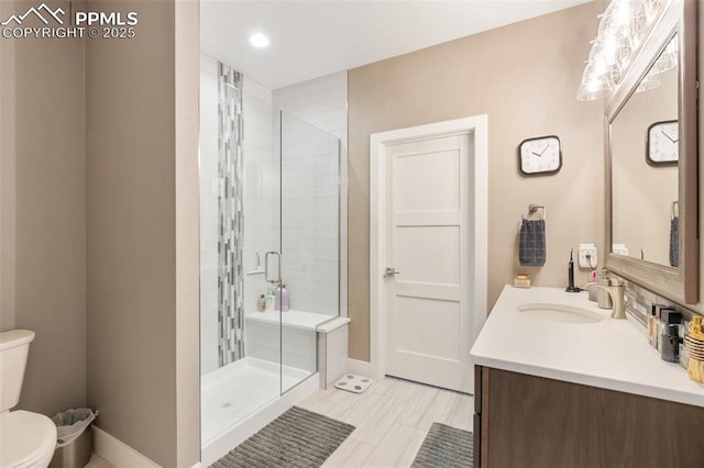 20356 Royal Troon Dr, Monument, CO 80132 - bathroom with toilet, a shower stall, vanity, baseboards, and recessed lighting