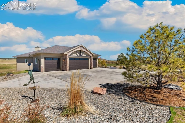 20356 Royal Troon Dr, Monument, CO 80132 - view of front of property featuring an attached garage, driveway, and a chimney
