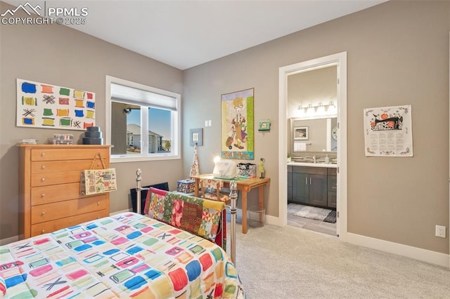 20356 Royal Troon Dr, Monument, CO 80132 - bedroom with carpet flooring, connected bathroom, baseboards, and a sink