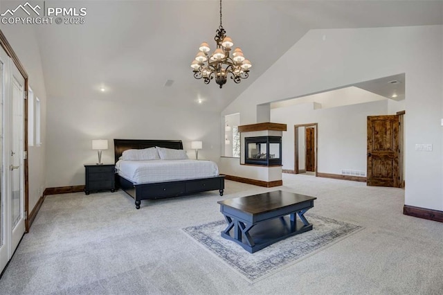 bedroom with carpet, high vaulted ceiling, a notable chandelier, and baseboards