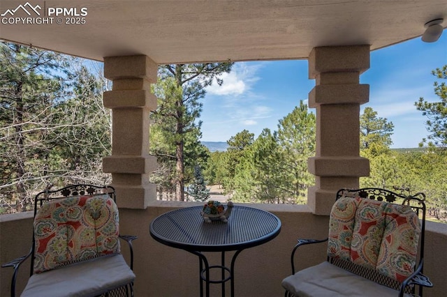 view of patio featuring a balcony
