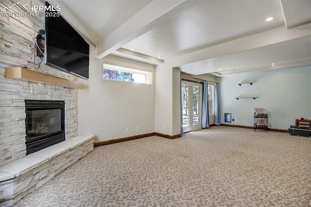 unfurnished living room featuring baseboards, carpet, a fireplace, beam ceiling, and recessed lighting