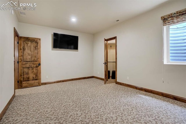 empty room with baseboards, visible vents, and recessed lighting