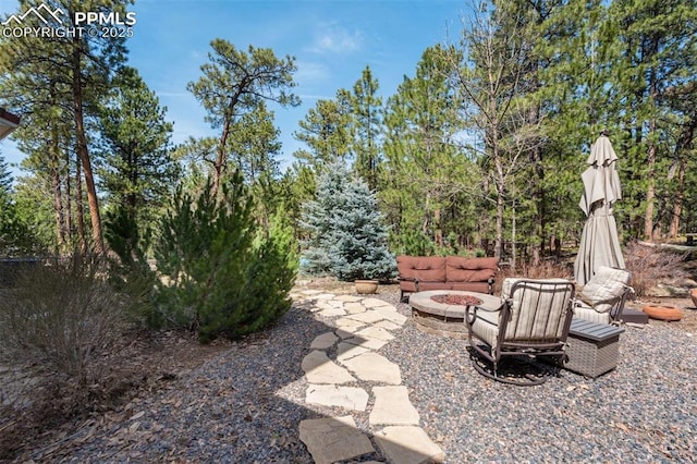 view of patio / terrace featuring an outdoor fire pit