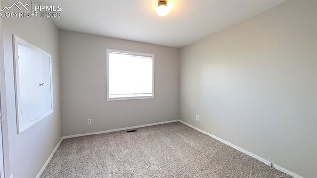 720 W Northwoods Dr, Woodland Park, CO 80863 - empty room featuring carpet, visible vents, and baseboards