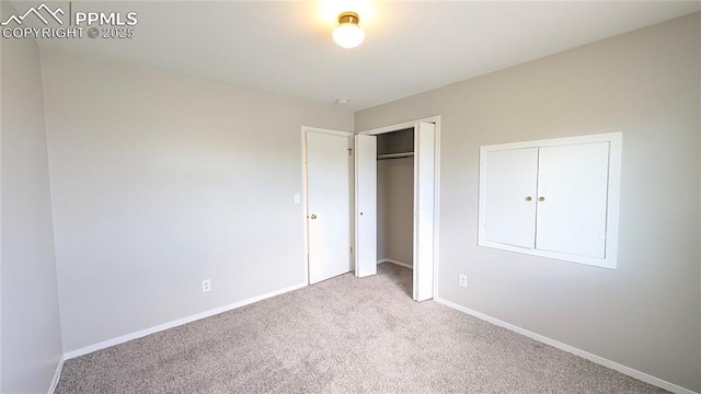 720 W Northwoods Dr, Woodland Park, CO 80863 - unfurnished bedroom with carpet, a closet, and baseboards