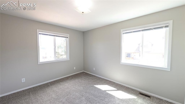 720 W Northwoods Dr, Woodland Park, CO 80863 - unfurnished room featuring baseboards, visible vents, and carpet