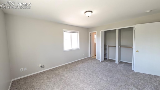 720 W Northwoods Dr, Woodland Park, CO 80863 - unfurnished bedroom with baseboards, carpet flooring, and a closet