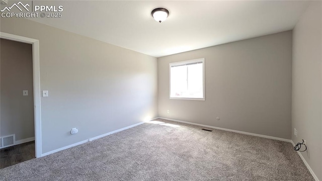 720 W Northwoods Dr, Woodland Park, CO 80863 - empty room featuring carpet floors, visible vents, and baseboards