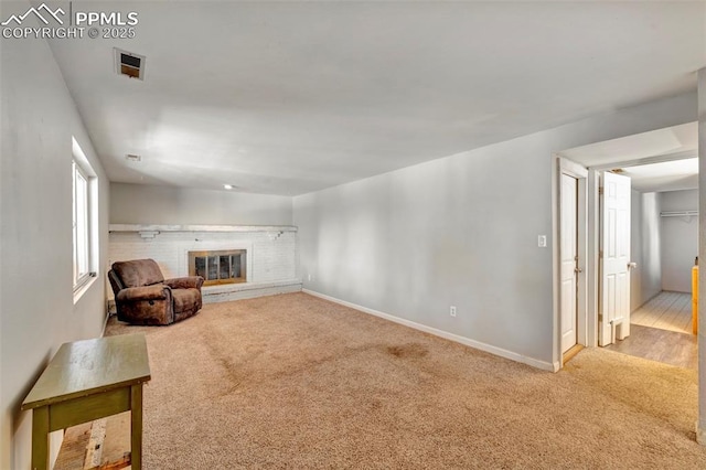 6465 Pawnee Cir, Colorado Springs, CO 80915 - unfurnished room featuring baseboards, carpet flooring, and a fireplace