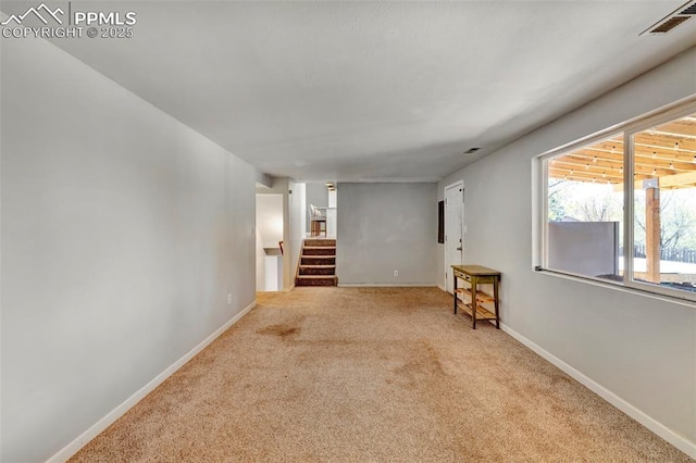 6465 Pawnee Cir, Colorado Springs, CO 80915 - carpeted empty room featuring visible vents, stairs, and baseboards