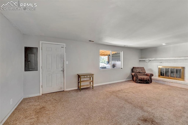 6465 Pawnee Cir, Colorado Springs, CO 80915 - living area with baseboards, carpet, a brick fireplace, and electric panel